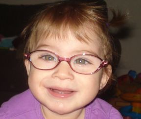 toddler girl in glasses for farsightedness