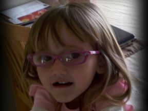 picture of a toddler girl in glasses