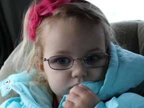 young girl in glasses