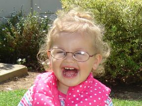 picture of a toddler girl in glasses for farsightedness
