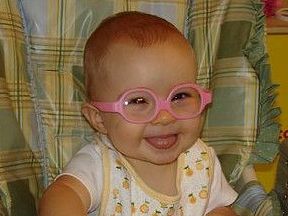 picture of a baby wearing glasses for farsightedness