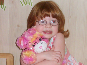 Destiny, 3 years old. She wears glasses for farsightedness The bear's glasses are from Build-a-Bear.