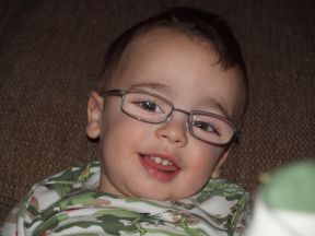 picture of a toddler boy wearing glasses for farsightedness