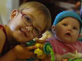 girl wearing glasses for farsightedness and amblyopia