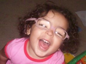 picture of a young girl who wears glasses for cataracts