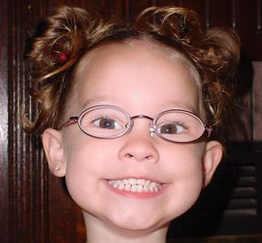 toddler girl who wears glasses for farsightedness and astigmatism