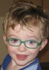 photo of a toddler boy in glasses