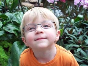 young boy in glasses