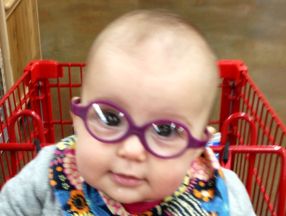 photo of a baby wearing glasses for strabismus
