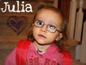 picture of a two year old girl in glasses