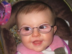 baby girl wearing glasses for farsightedness