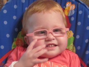 young toddler girl wearing glasses for farsightedness