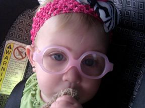 baby wearing glasses for farsightedness