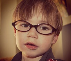 photo of a toddler boy in glasses