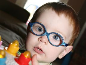 picture of a toddler boy in glasses