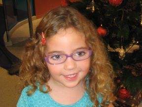 picture of a four year old girl in glasses