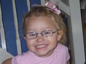 picture of a 3 year old girl wearing glasses