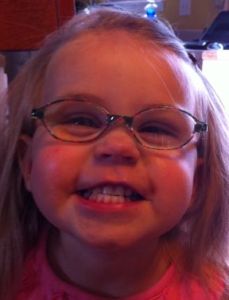 toddler girl wearing glasses for farsightedness and accommodative esotropia