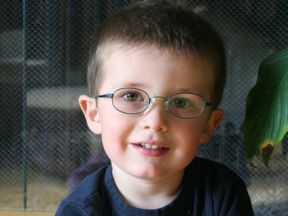 picture of a three year old boy in glasses for farsightedness
