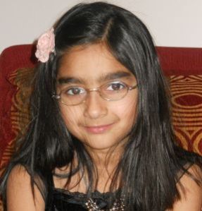 Salena, 8 years old. She wears glasses for farsightedness and astigmatism.