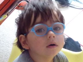 young boy wearing glasses