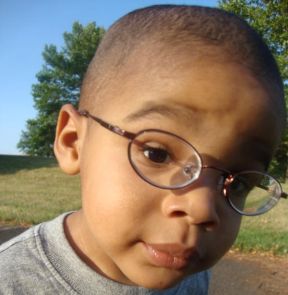 picture of toddler boy wearing glasses for nearsightedness.