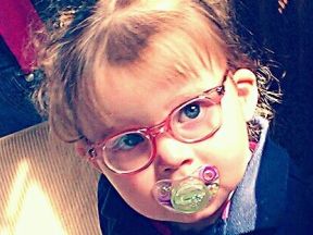 picture of a toddler girl in glasses