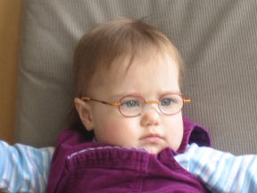 picture of a toddler wearing glasses