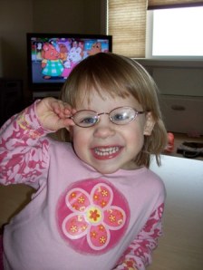 Pardon me, I can see, by Barb.  Kaylee wears glasses for strabismus and amblyopia.