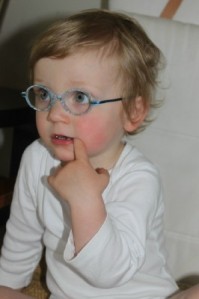 Stella, back in May, on her first day with glasses. (She was 20 months old.)