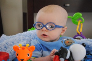 3 month old boy wearing glasses for congenital cataracts