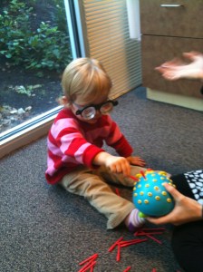 toddler wearing therapeutic prism lenses during vision therapy