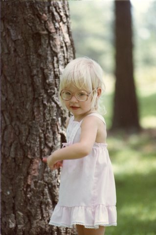 picture of a young girl in glasses from the '80s