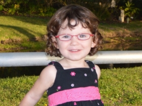 2 year old in red glasses for esotropia and hyperopia